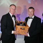 John Davidson of Davidson Retail Butchers collecting his champagne raffle prize from Geoff Hurst.
