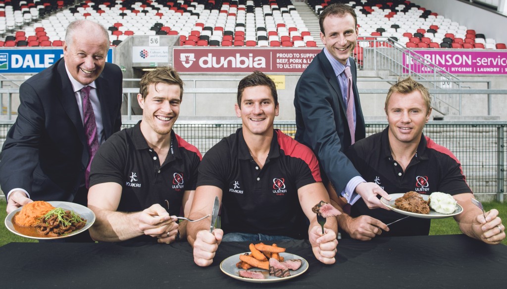 Jack Dobson, Dunbia executive director (l) and Matthew Dobson, Dunbia managing director, serve up beef dishes to Ulster Rugby players Andrew Trimble, Robbie Diack and Roger Wilson.