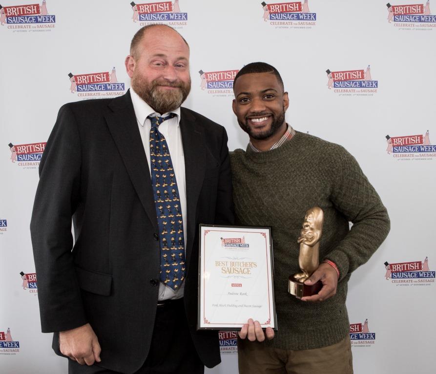 Andrew Rook of J.C. Rook & Sons receiving the award for Best British Banger from British Sausage Week ambassador JB Gill.